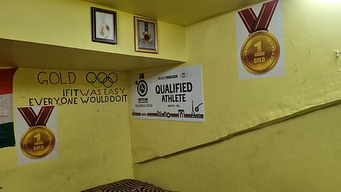 Pictures of Olympic gold medal adorn the walls of Aman Sehrawat's room at Chhatrasal Stadium, alongside his proudly pinned Olympic berth ticket.